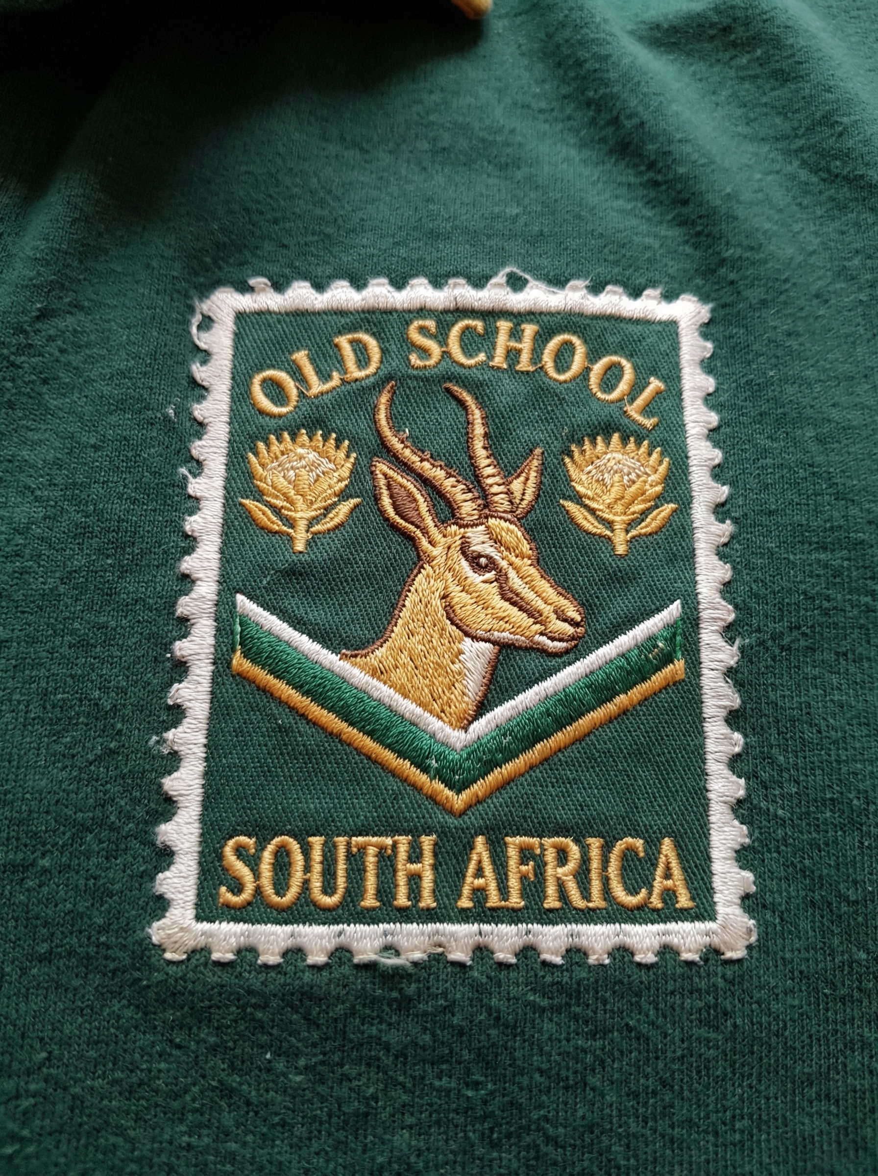 Badge WIP, stamp form, springbok head with chevron, version one